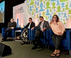 Director moderating a plenary session at the American Association for Public Opinion Research conference in Chicago, Illinois