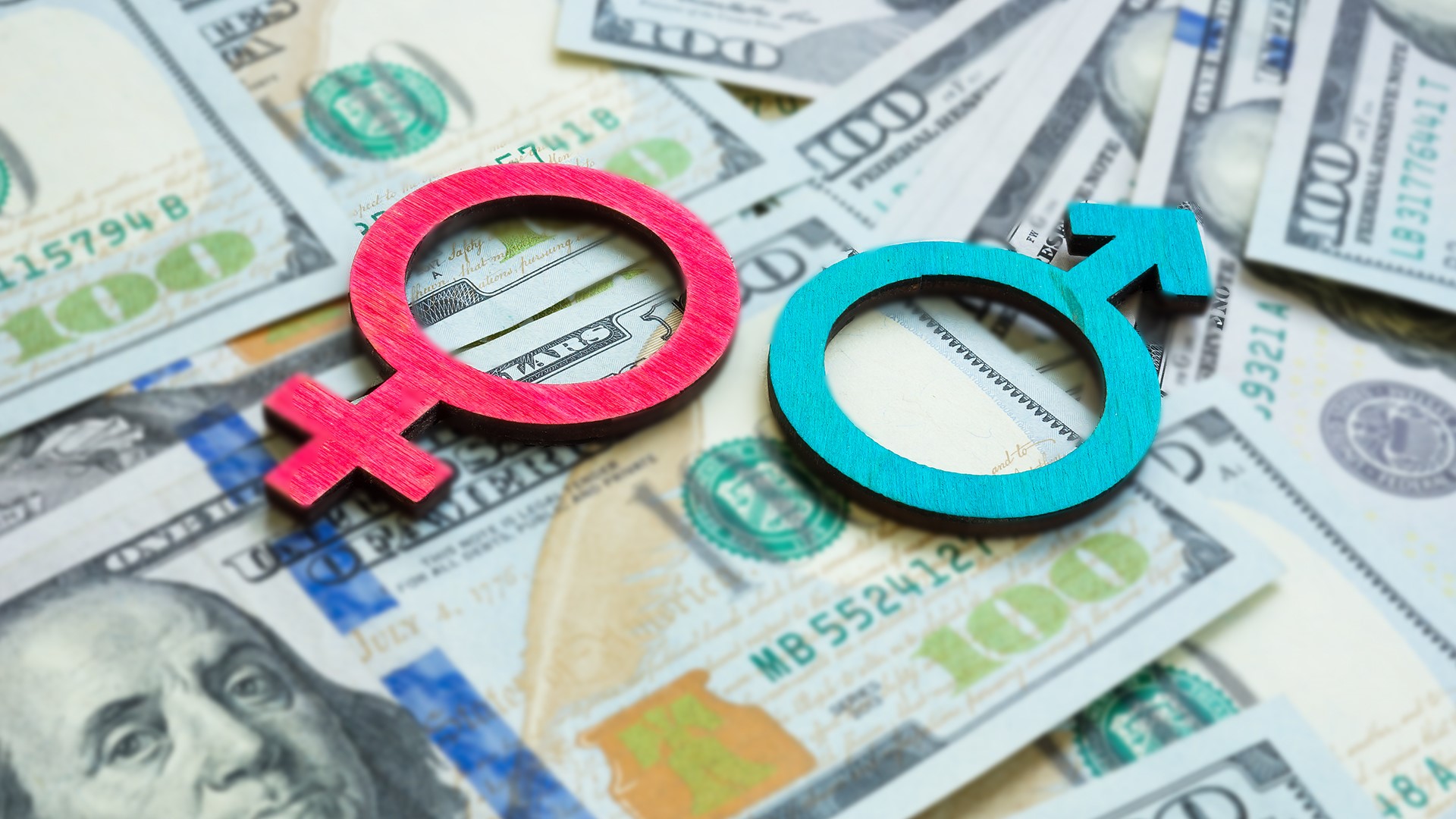 Female and Male Symbols Over Money