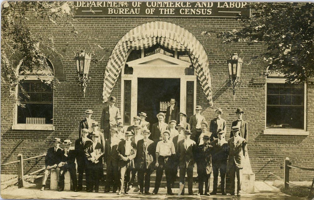 Employees of the U.S. Census Bureau pose in front of the Emery Building. 